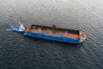 tugboat and barge on water