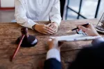 a lawyer and client review terms of a contract 