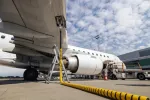 photo of airplaine refueling at airport 
