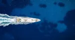 boat making wake in open water