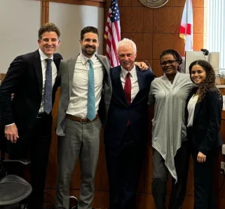 Image of Morgan & Morgan attorneys Crosby Crane, Jonathan Brozyna, Bob Joyce, and Karighan Walker with Jessina