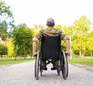 veteran in a wheelchair with their back towards the viewer