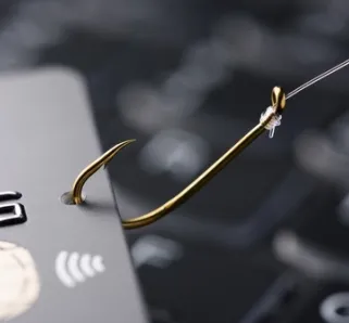 credit card on a fishing hook indicating a phishing or financial c