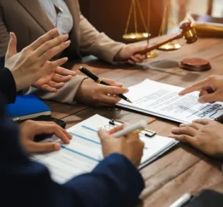 group of employees discussing contract agreement together