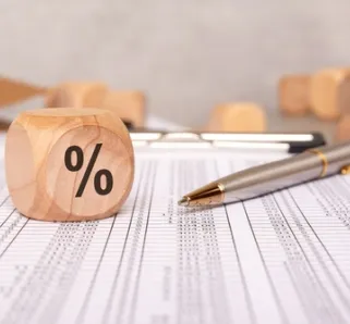 percentage block and various paperwork with numerical caluclations