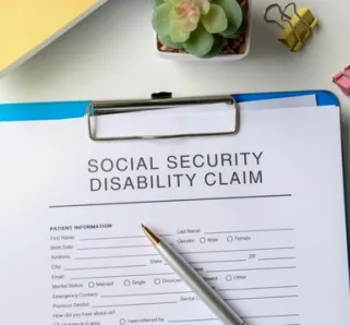 clip board with social security disability claim papers on it. 