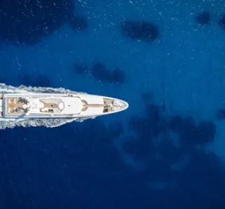 boat making wake in open water