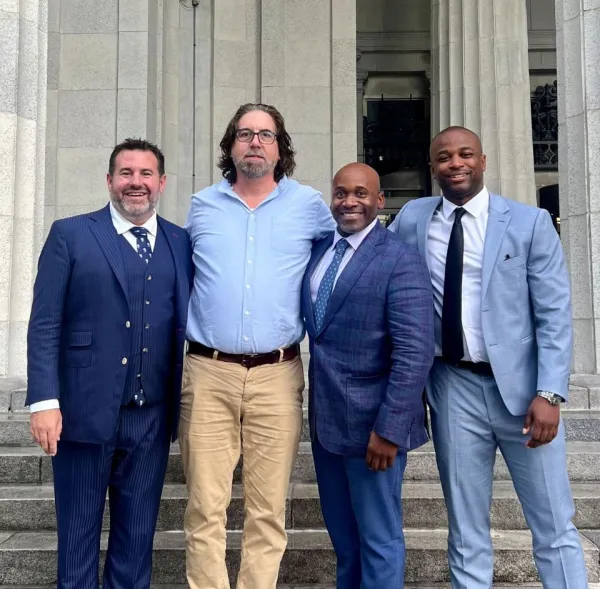 Omar M. with his morgan and morgan attorneys