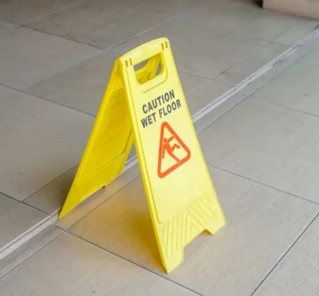 floor with yellow and red caution sign for wet floor