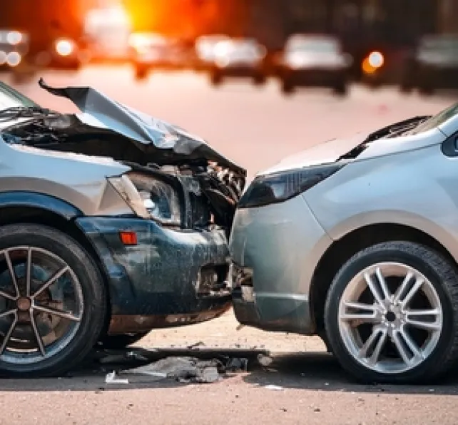 car crash between two cars on street