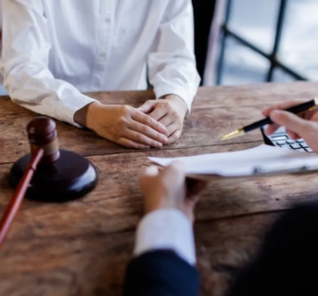 a lawyer and client review terms of a contract 