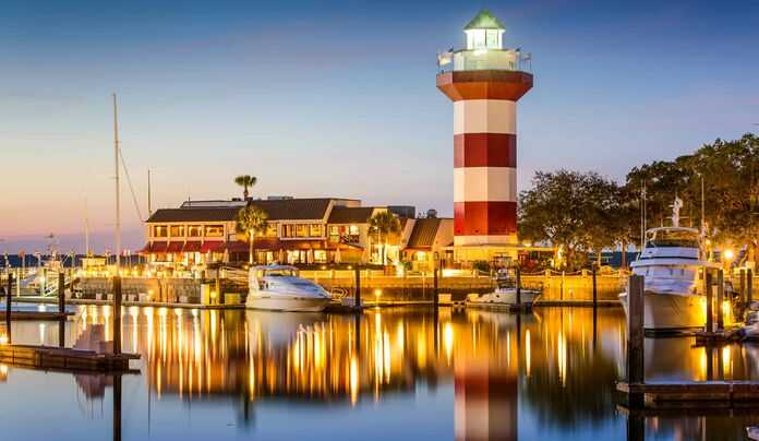 Hilton Head lighthouse and marina at dusk, reflecting the guiding presence of personal injury lawyers in the area.