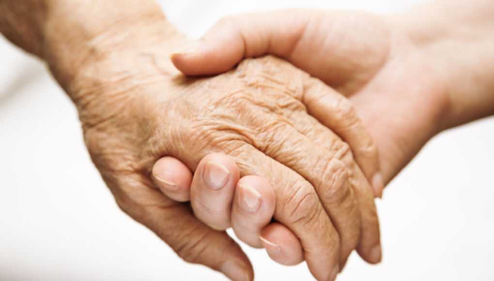 Signs of Nursing Home Abuse and Neglect - Elderly and Young Holding Hands
