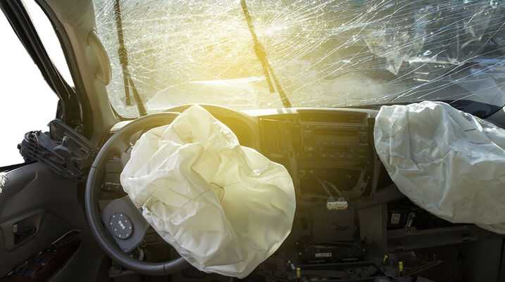 Takata Recall Expands as Death Toll Rises - An deployed airbag in a vehicle post-collision