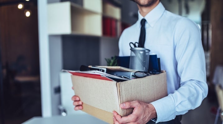 Man with Box of office supplies