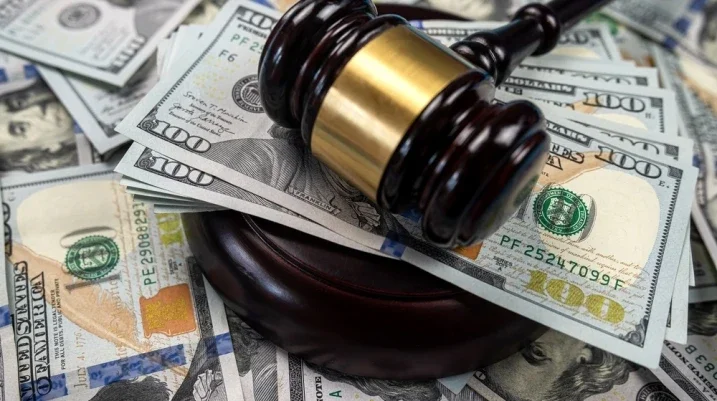 What Damages Can You Sue For - judge hammer with cash