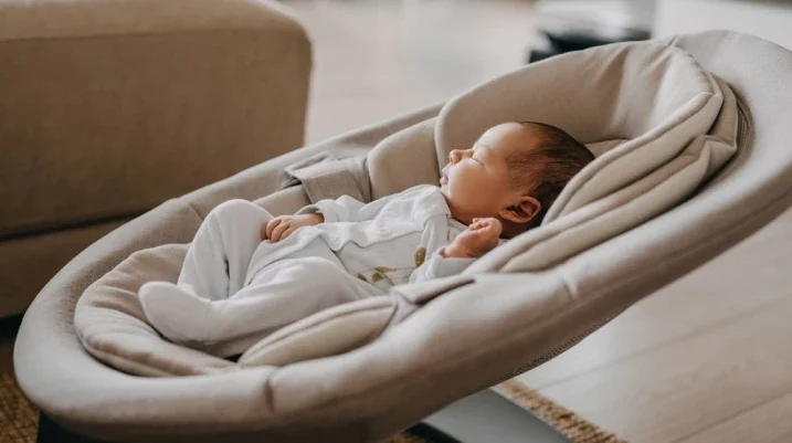 baby in a baby swing