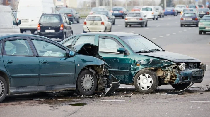 Two green cars crashed into each other