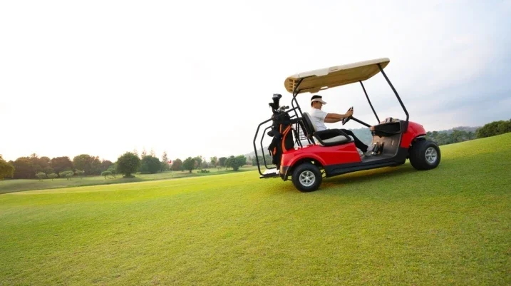 Man driving a golf cart