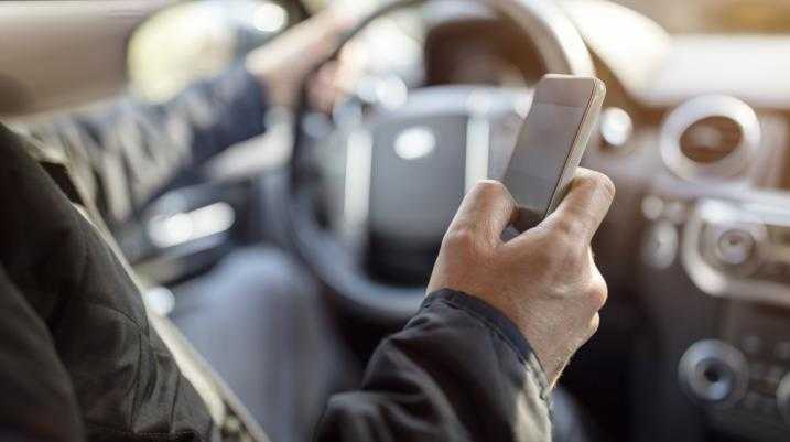 Man texting while driving