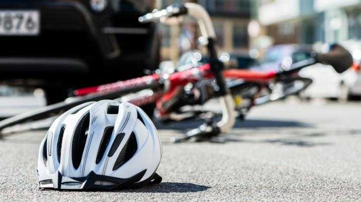 Bike helmet and bike fallen down on the road