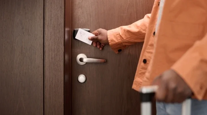 Someone unlocking their hotel room