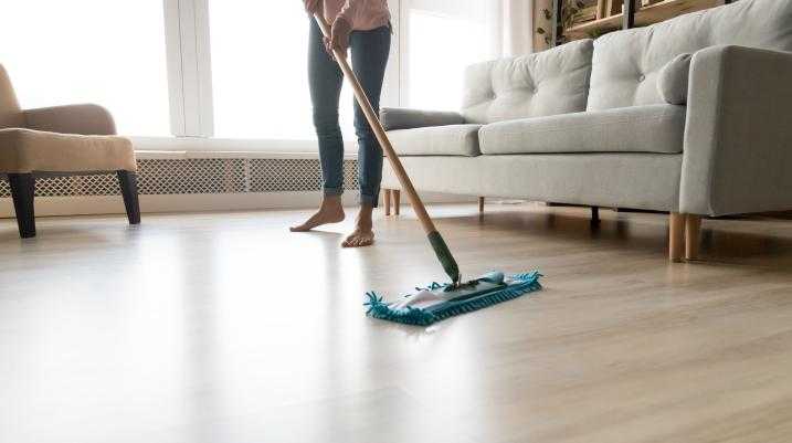Woman mopping the floor