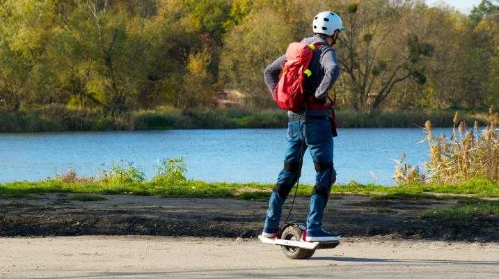 Man riding on a one-wheel skateboard