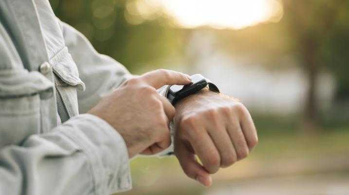 Man looking at his Apple watch