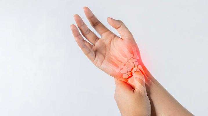 Man holding hand in pain 