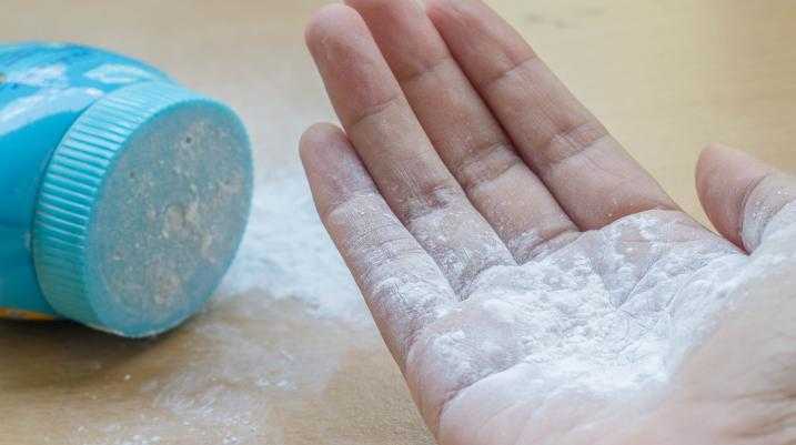 Talcum powder in someones hand