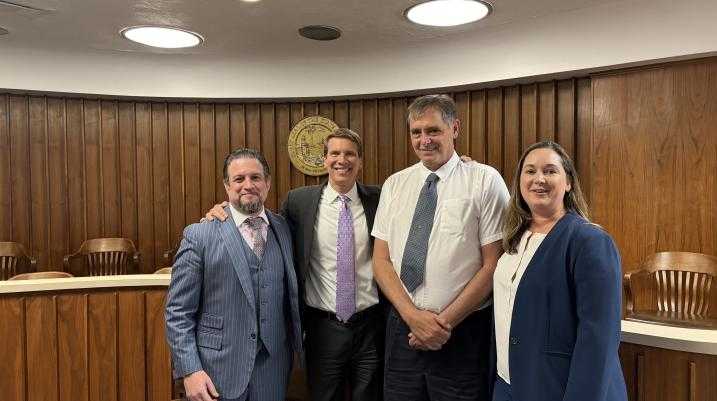 morgan & morgan attorneys with client after a large win