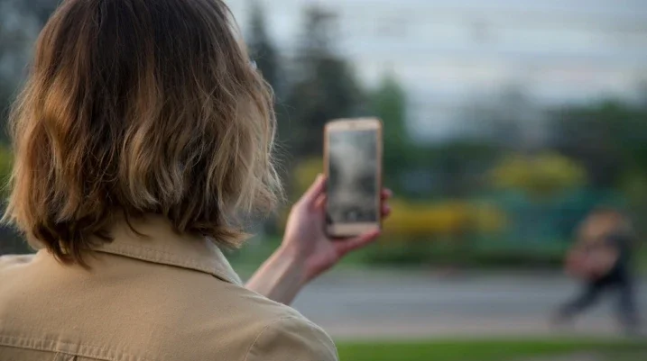 taking a video of someone