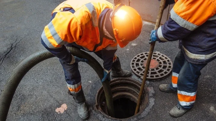 construction worker near a manhole