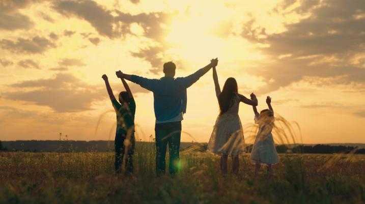 family with a sunset in the background