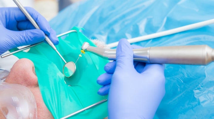 dentist filling a patient's tooth
