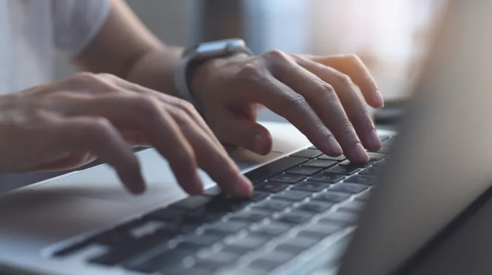 Person typing on a computer