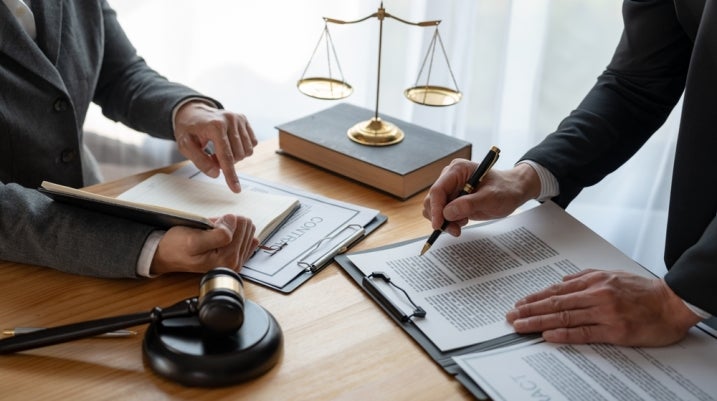 lawyer speaking with a client