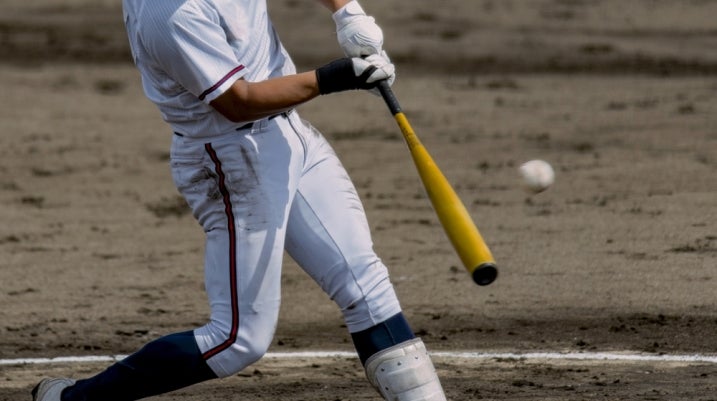 baseball player hitting the baseball