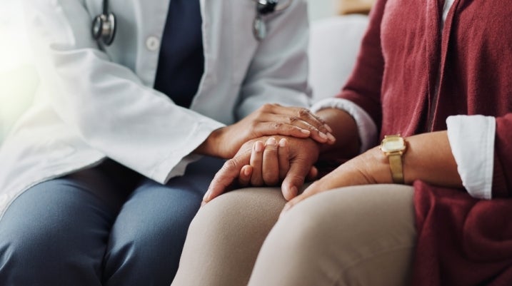doctor talking to a patient about their cancer diagnosis