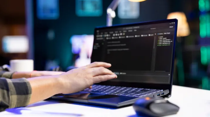 Someone typing on a computer