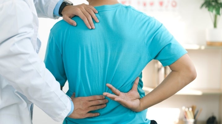 Chiropractor helping a patient