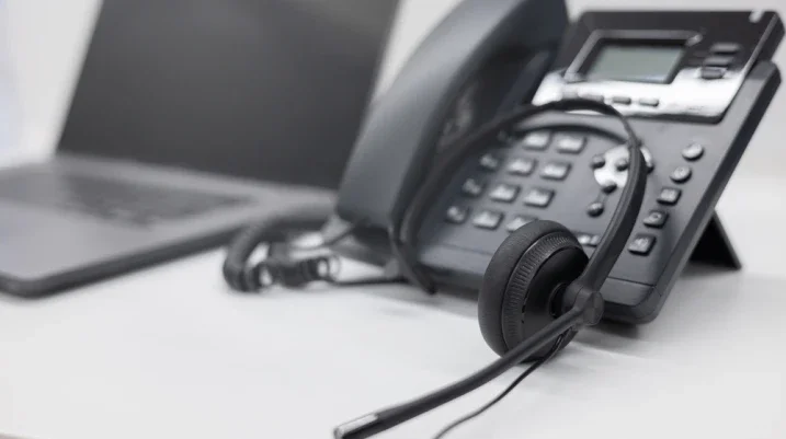 phone with headset in a call center