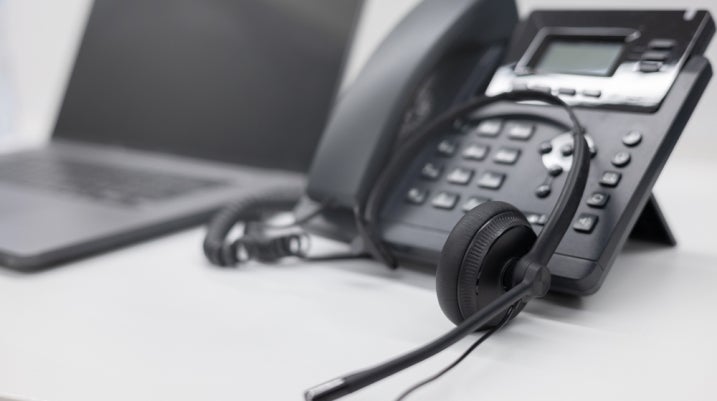 phone with headset in a call center