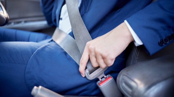 putting on a seat belt