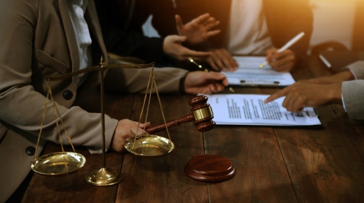 full team of lawyers and judge
