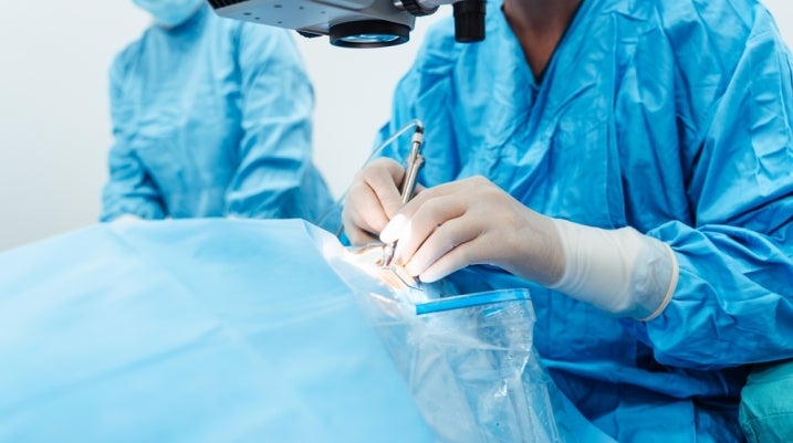 surgeon working on a patient in surgery