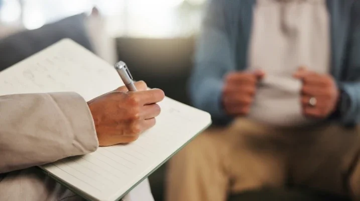 Psychiatrist speaking to a client