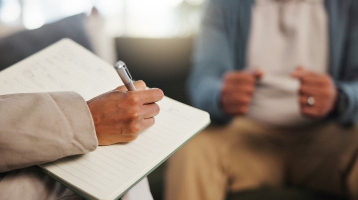 Psychiatrist speaking to a client