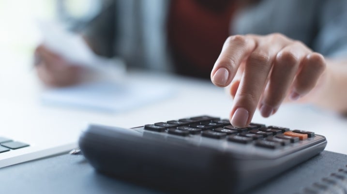 Man using a calculator